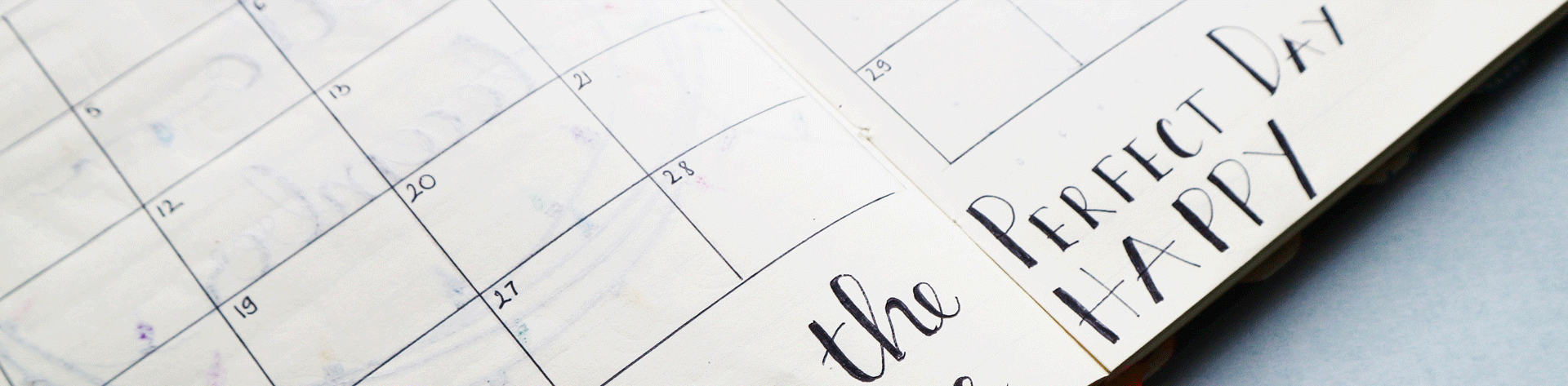 Faded view of a monthly calendar with Happy Perfect Day written on it