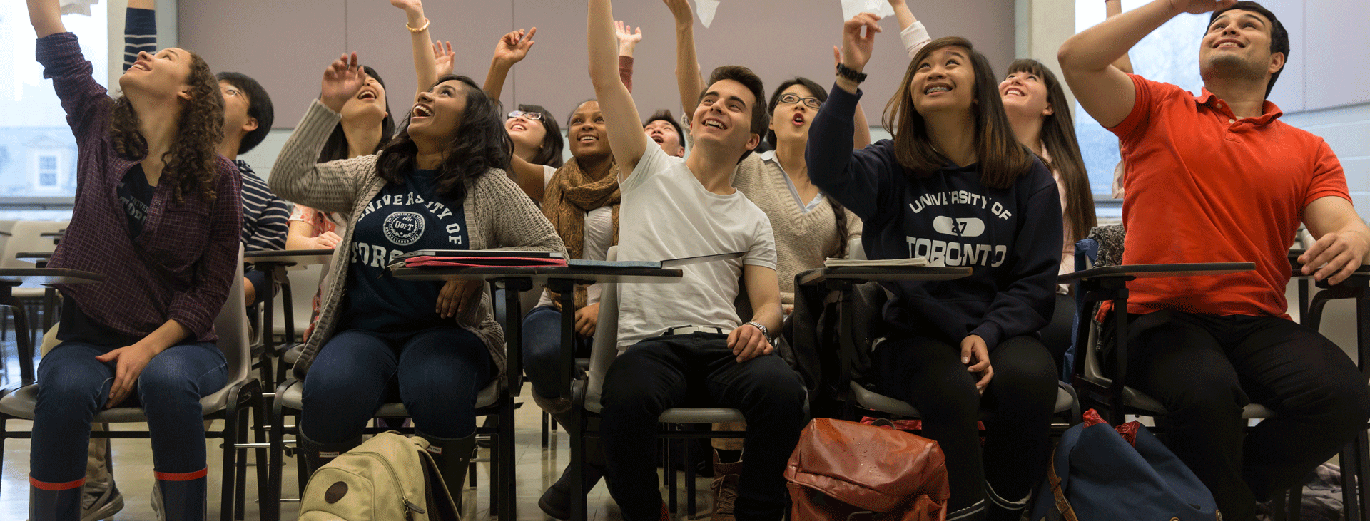 A classroom of students celebrating