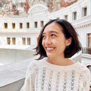 Emily smiling to the side.